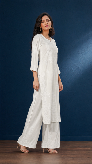 White chikankari kurta with 3/4 sleeves and embroidered border