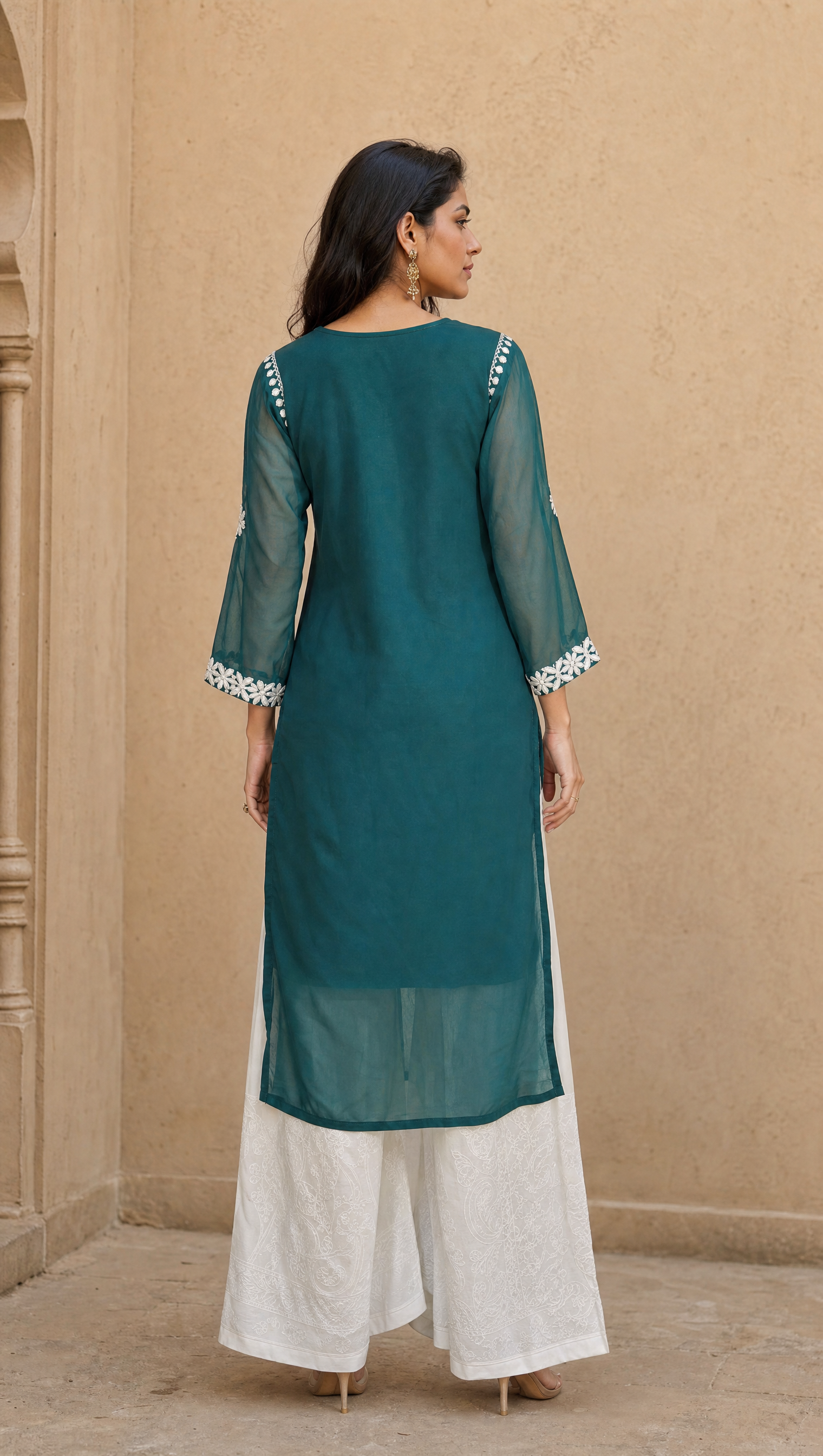 White rayon cotton palazzo paired with teal green chikankari georgette kurta