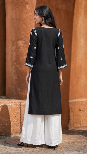 White rayon cotton embroidered palazzo paired with black chikankari kurta